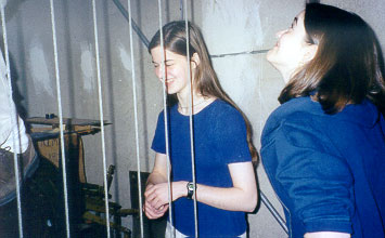 Erin and Katie wait for their turn on the ladder