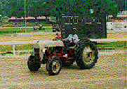 lawrece simmons on his tractor at the county fair