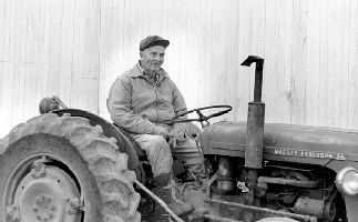 Doc sitting on his tractor