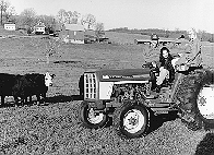 student and farmer on tractor